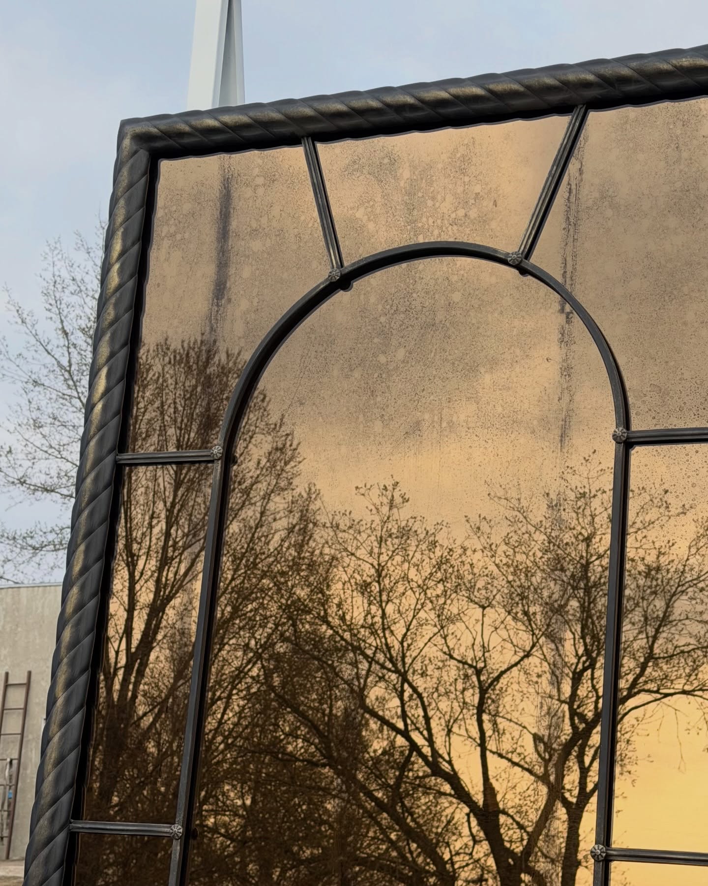 Bespoke metal mirror frame with custom steel detailing