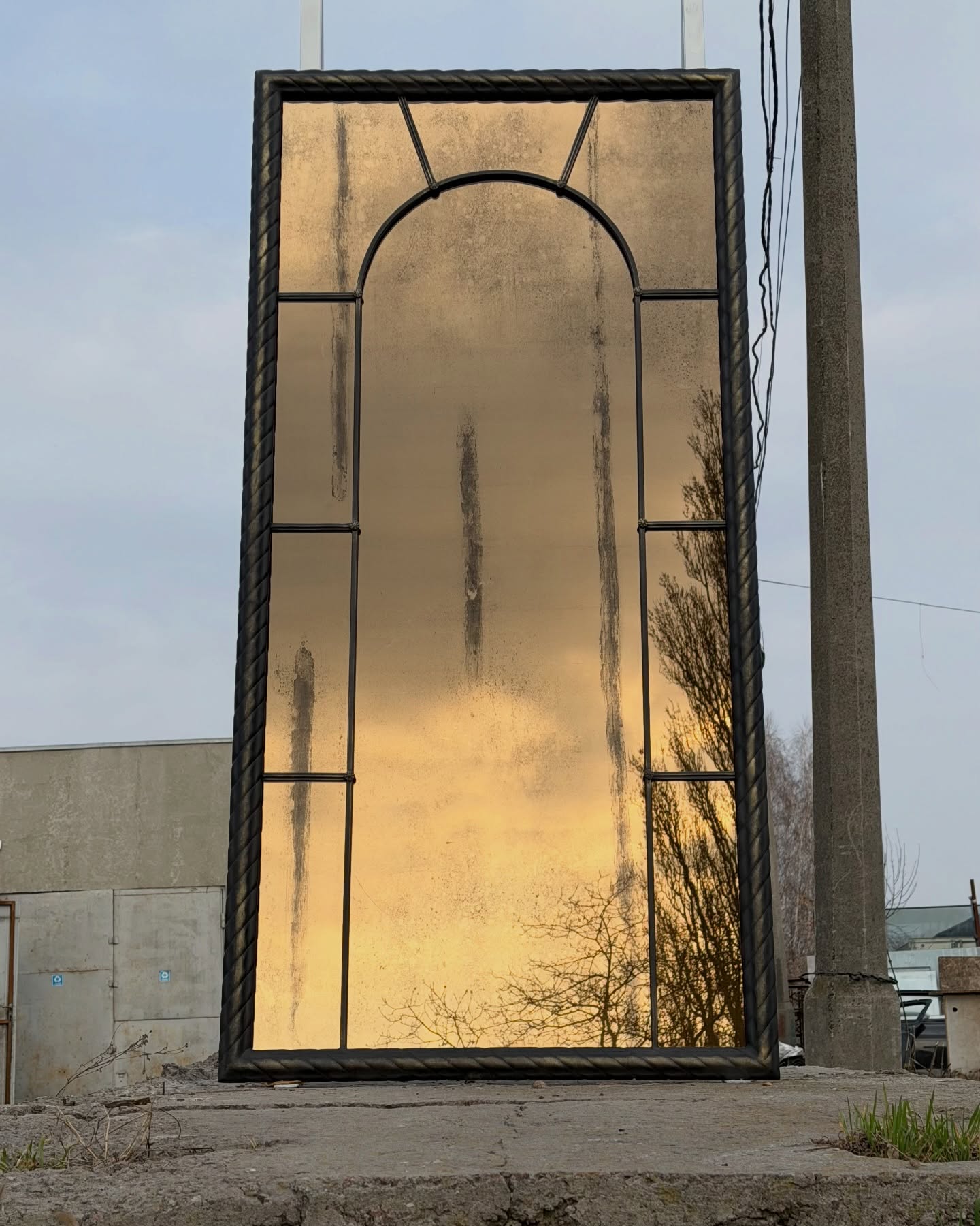 Vintage style metal framed mirror with oxidized patina finish