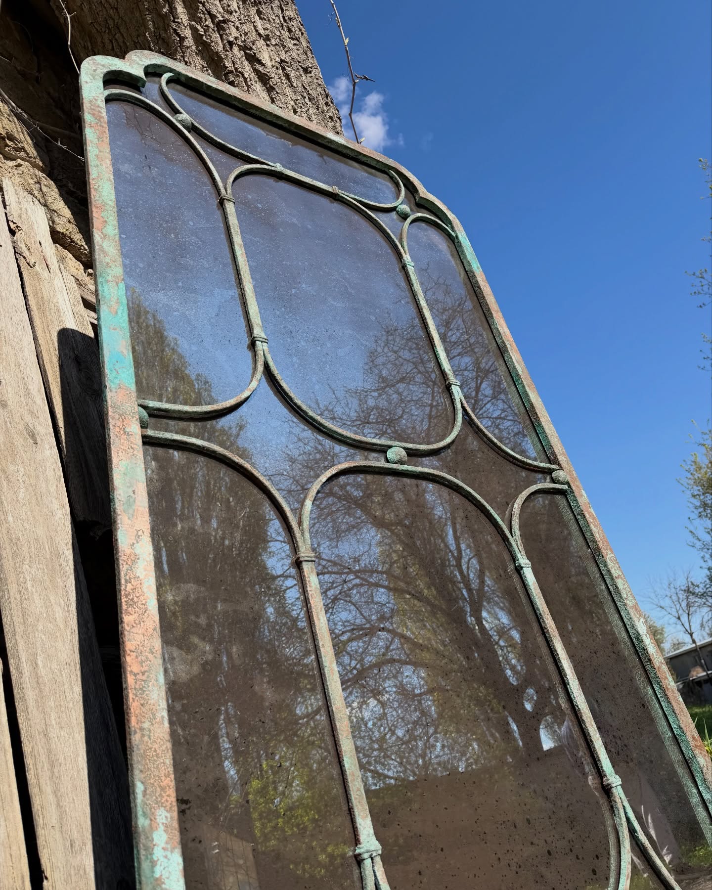 Custom arched steel mirror frame for hotel lobby