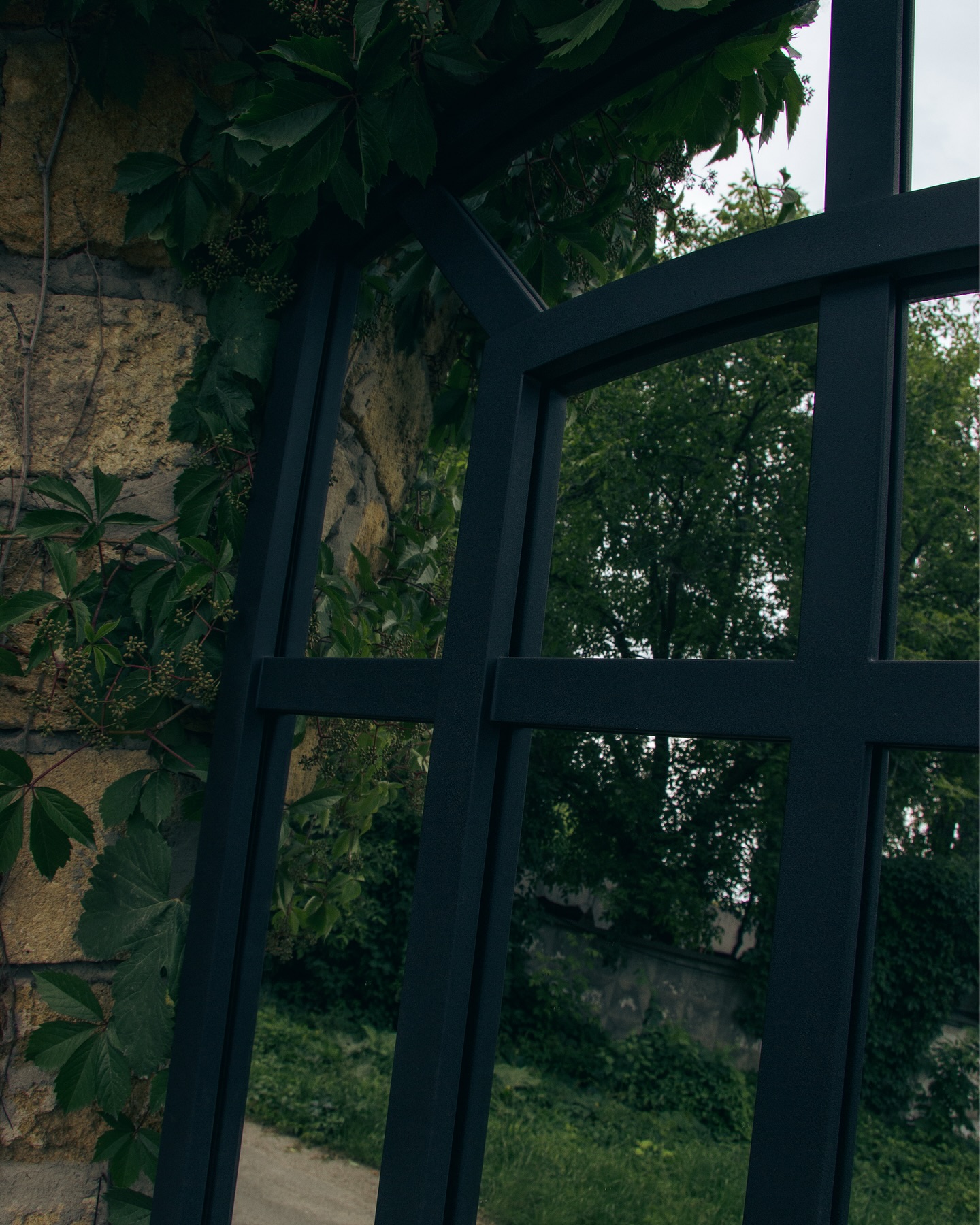 Custom steel mirror frame with vintage patina treatment