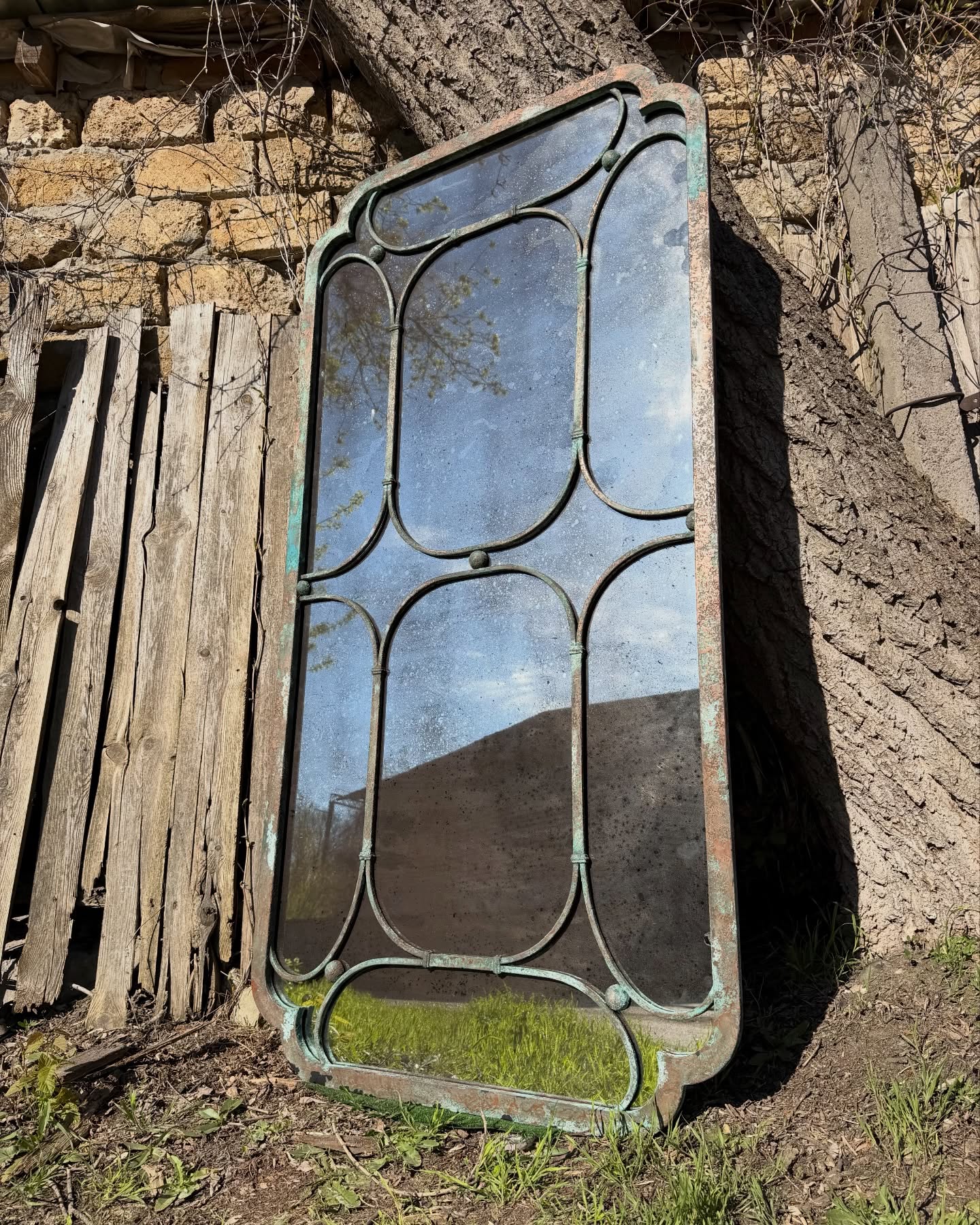 Decorative steel frame mirror detail showing custom arches