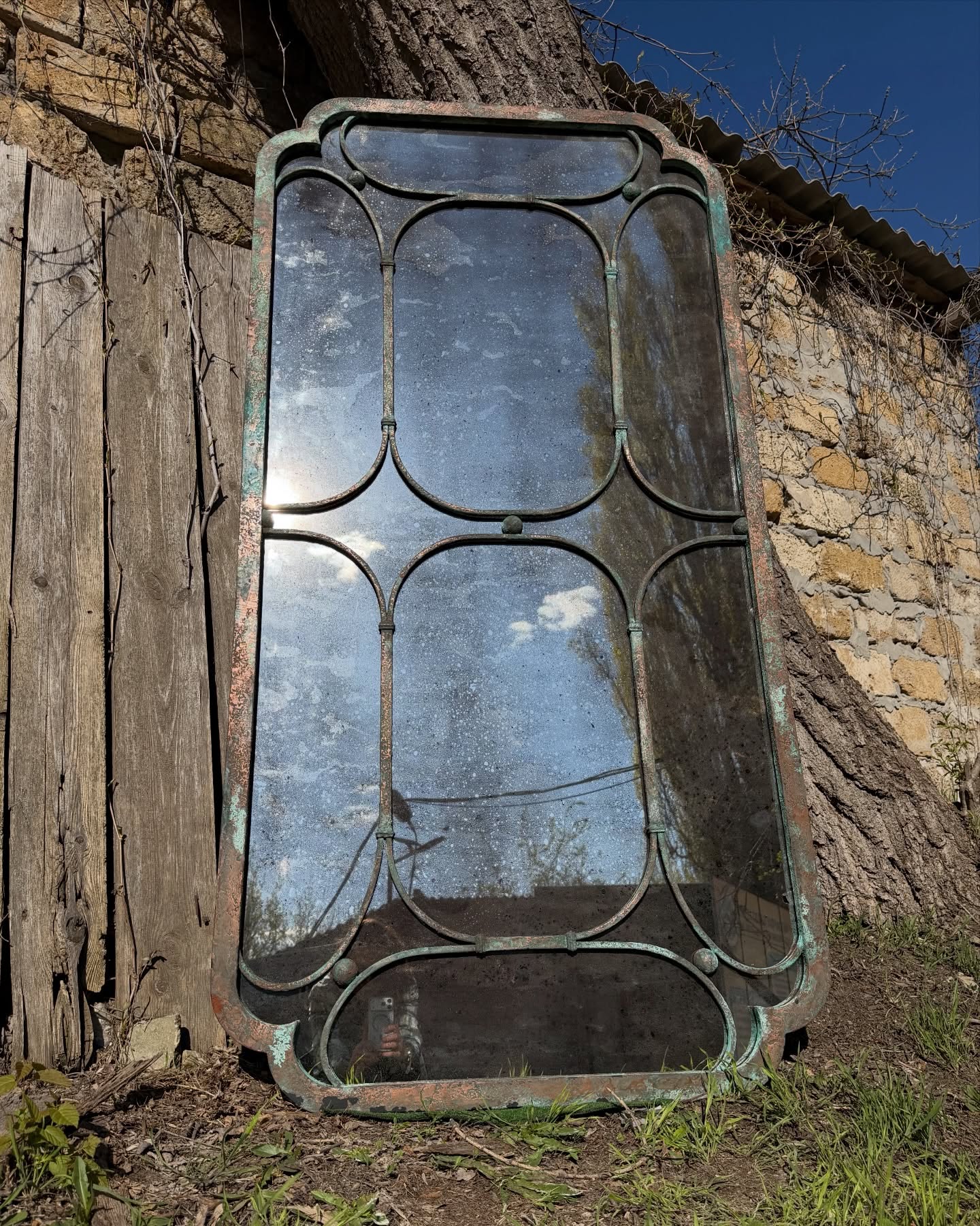 Handcrafted steel mirror frame with chemically developed patina finish