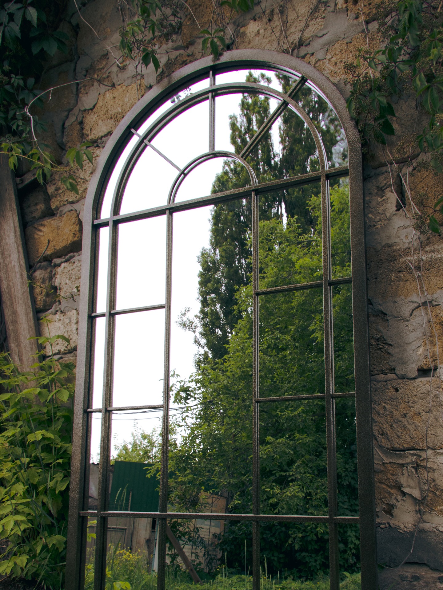 Custom gothic mirror with decorative steel fretwork