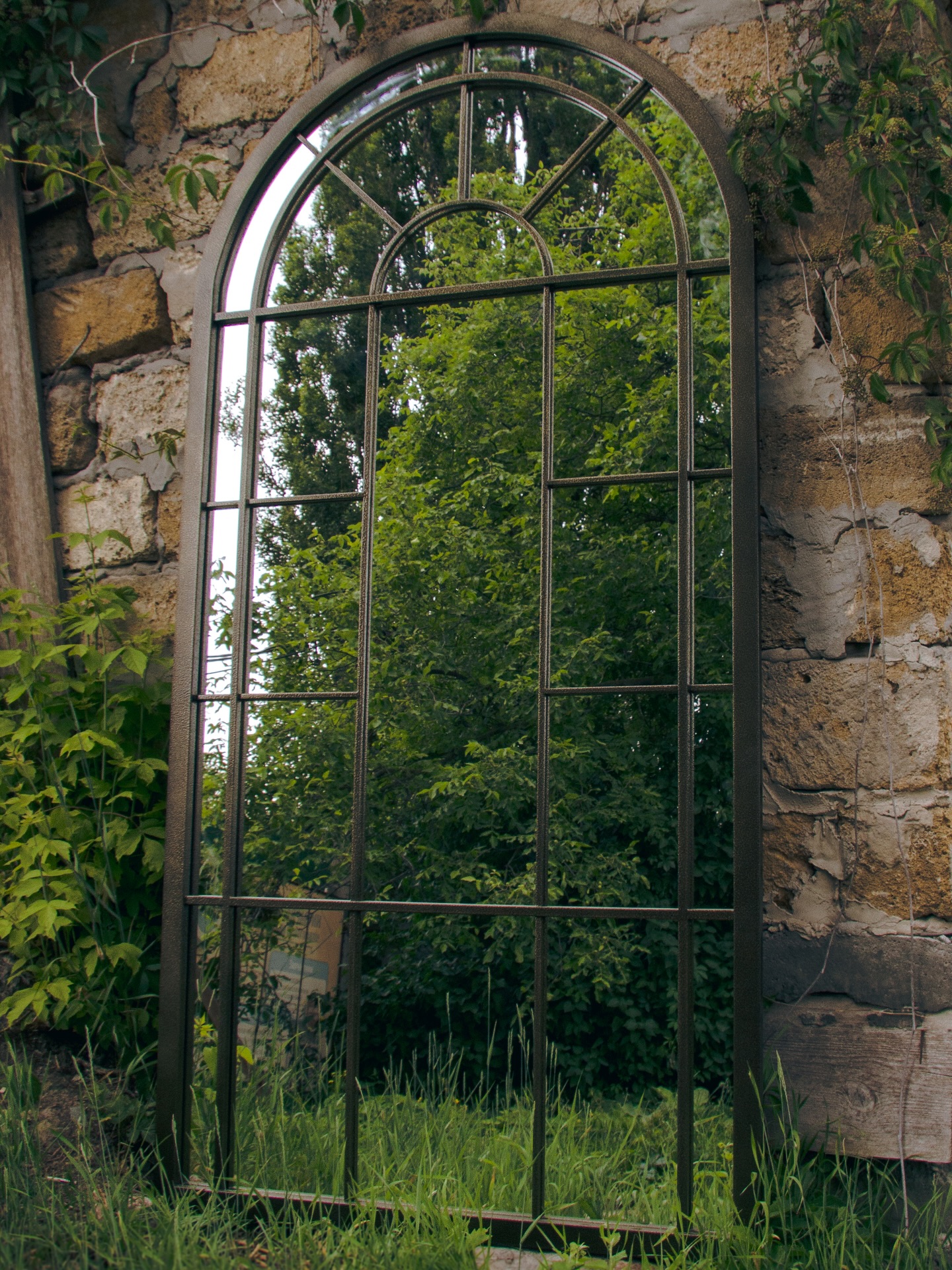 Large scale architectural steel mirror for dining room wall
