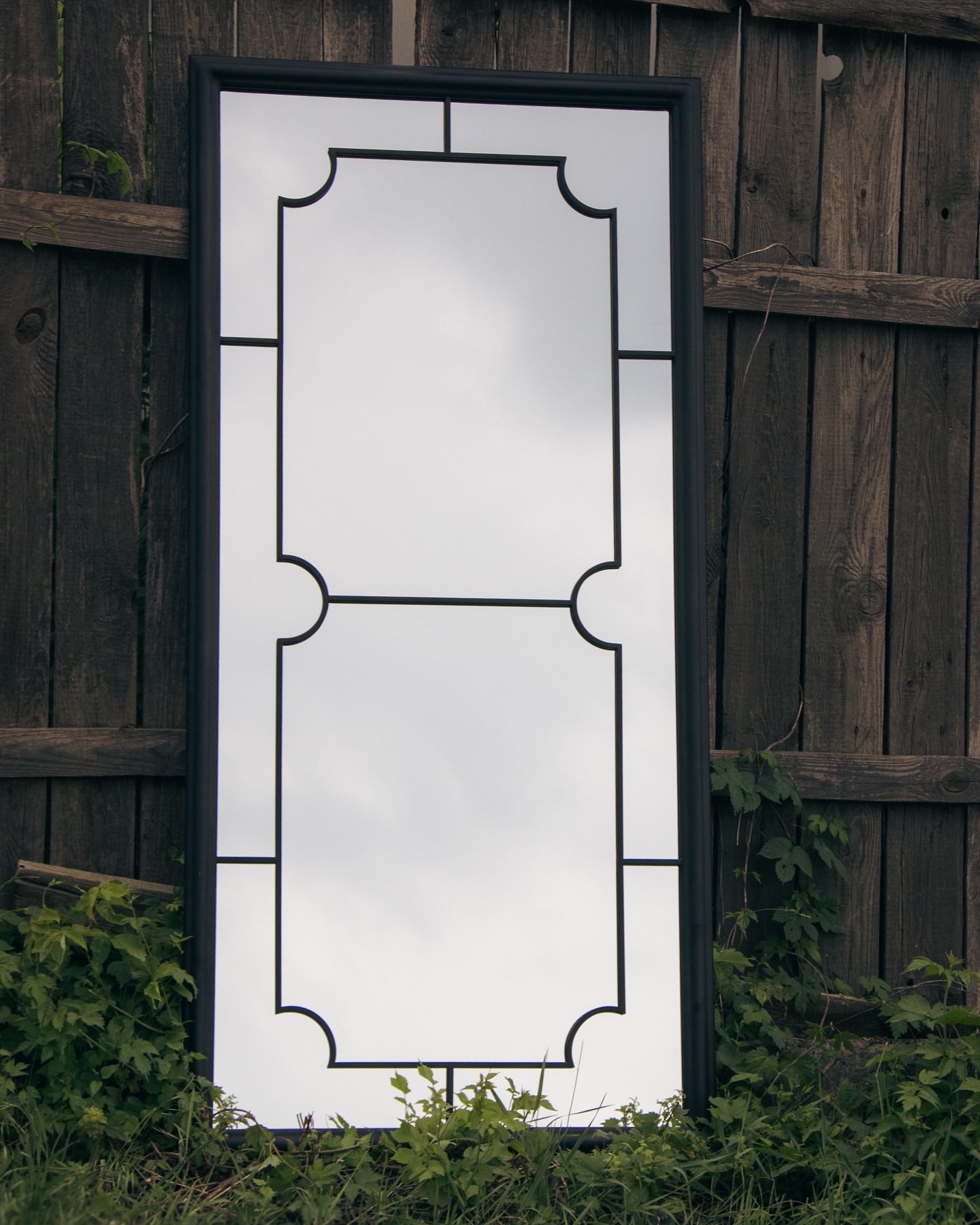 Custom steel mirror frame with chemical patina details