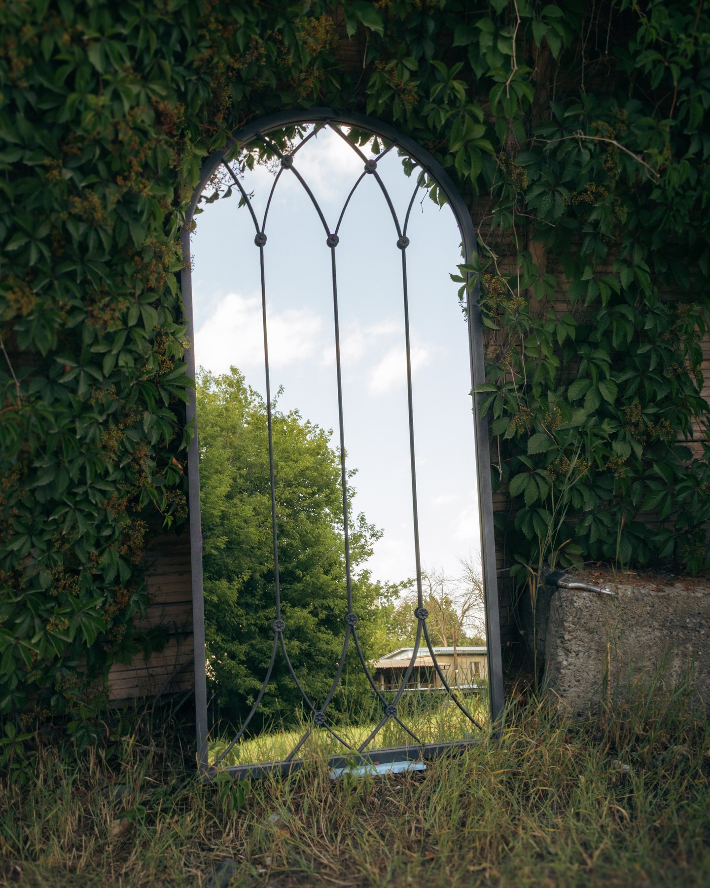 Antique distressed glass mirror in custom steel frame